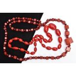 A CHERRY AMBER BAKELITE BEAD NECKLACE AND ONE OTHER, the first a graduated oval bead necklace,