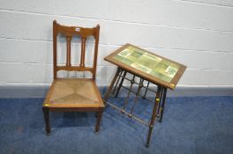 AN EARLY 20th CENTURY MAHOGANY OCCASSIONAL TABLE with floral tilled top tapered round legs with