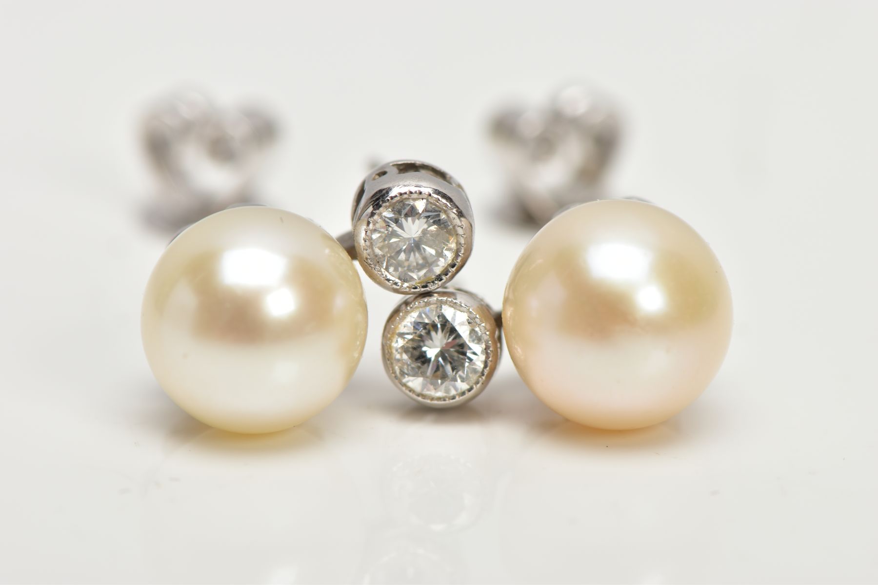 A PAIR OF WHITE METAL DIAMOND AND CULTURED PEARL EARRINGS, each designed with a single cultured - Image 2 of 3