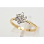 AN OLD CUT DIAMOND CLUSTER RING, a seven stone diamond cluster, claw set to tapering chenier