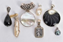 SEVEN ASSORTED SEMI-PRECIOUS GEMSTONE PENDANTS, seven white metal pendants set with stones such as