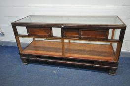 AN EARLY 20TH CENTURY HABERDASHERY CABINET with a glazed top, front and sides, four wooden sliding