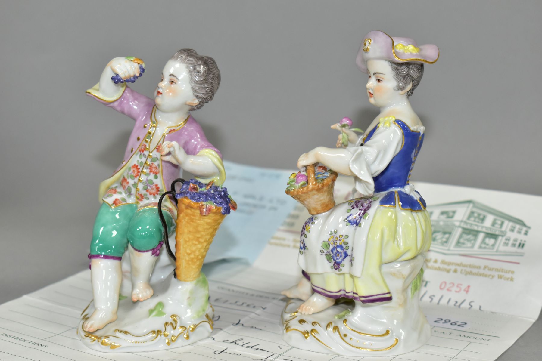 A PAIR OF EARLY 20TH CENTURY MEISSEN FIGURES OF A YOUNG BOY AND GIRL, both seated, the boy holding a - Image 2 of 6