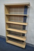 A WINSOR TIBRO OAK FEATURE BOOKCASE, comprising of five open shelves, new and unused condition,