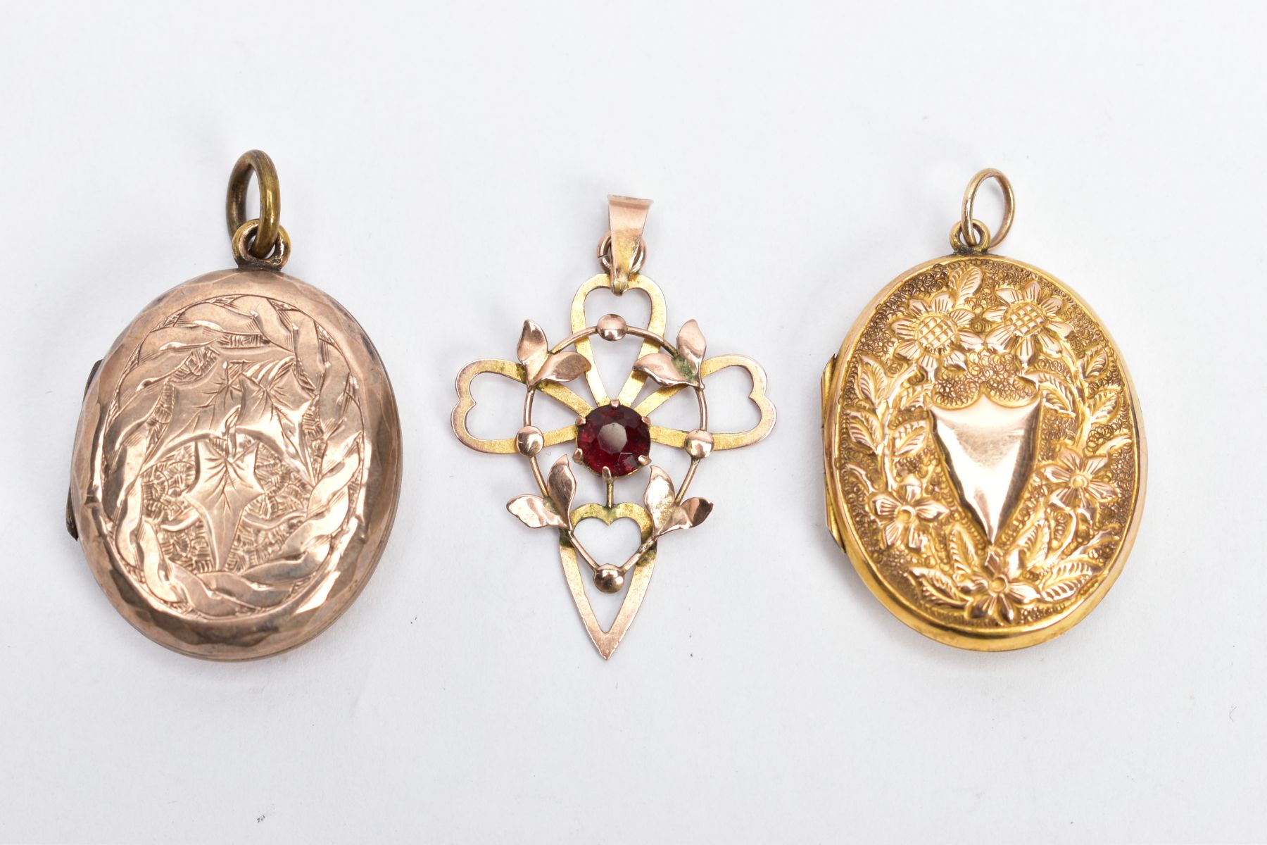 AN EARLY 20TH CENTURY 9CT GOLD PENDANT AND TWO LATE VICTORIAN 9CT FRONT AND BACK LOCKETS, the