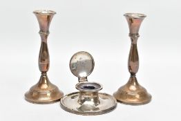 A PAIR OF SILVER CANDLESTICKS AND A SILVER CAPSTAN INK WELL, each candle stick with a knopped