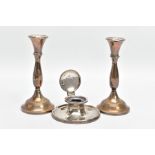 A PAIR OF SILVER CANDLESTICKS AND A SILVER CAPSTAN INK WELL, each candle stick with a knopped