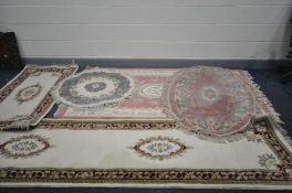 FIVE VINTAGE WOOL RUGS comprising of an hand knotted cream ground runner with red and green border