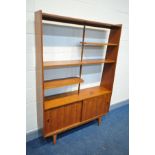 A MID CENTURY DANISH STYLE TEAK ROOM DIVIDER/BOOKCASE, with double sliding doors, width 123cm x