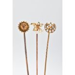 THREE LATE 19TH TO EARLY 20TH CENTURY STICKPINS, the first designed as a crescent moon and central