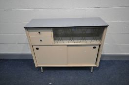 A 1950s KITCHEN CABINET with two sliding doors below two short drawers and two glass sliding