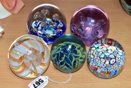 FIVE GLASS PAPERWEIGHTS, comprising three Caithness (Moonflower, Myriad and Ribbons), a Mdina