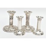TWO PAIRS OF SILVER DWARF CANDLESTICKS, the first pair designed with column stems, tapered base