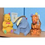 THREE BOXED ENESCO/BORDER FINE ARTS STUDIO DISNEY CLASSIC POOH MONEY BANKS, comprising three