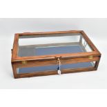 A WOODEN AND GLASS JEWELLERY DISPLAY CABINET, with a fitted blue fabric slightly tiered interior,