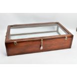 A WOODEN AND GLASS JEWELLERY DISPLAY CABINET, with a fitted blue fabric slightly tiered interior,