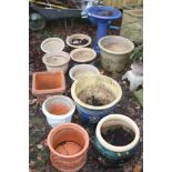 A QUANTITY OF GLAZED AND TERRACOTTA PLANT POTS and a blue glazed bird bath 52cm high