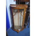 AN EARLY 20TH CENTURY WALNUT DEMI LUNE CHINA CABINET, width 64cm x depth 31cm x height 120cm