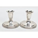 A PAIR OF DANISH SILVER GEORG JENSEN BY SVEN TOXVAERD DWARF CANDLESTICKS, the tapered slightly