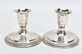 A PAIR OF DANISH SILVER GEORG JENSEN BY SVEN TOXVAERD DWARF CANDLESTICKS, the tapered slightly
