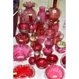 A GROUP OF CRANBERRY GLASS ITEMS, including a footed jug having Mark W MFM with cranberry insert,