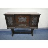A CHINESE CARVED HARDWOOD FALL FRONT BUREAU on trestle stand with letter cubbies, small drawer