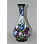 A MOORCROFT POTTERY BALUSTER VASE DESIGNED BY RACHEL BISHOP, decorated with blue flowers on a
