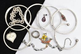 AN ASSORTMENT OF COSTUME JEWELLERY, to include a stainless steel torque bangle, detailed with