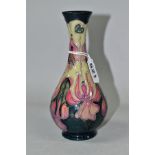 A MOORCROFT POTTERY FUSCHIA PATTERN BALUSTER VASE, a Collectors Club issue, with tubelined