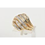 A 9CT GOLD DIAMOND DRESS RING, twenty one channel set diamonds set in a yellow and white gold mount,