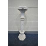 AN ALABASTER TORCHERE STAND with an octagonal base, a Corinthian fluted column with two foliate
