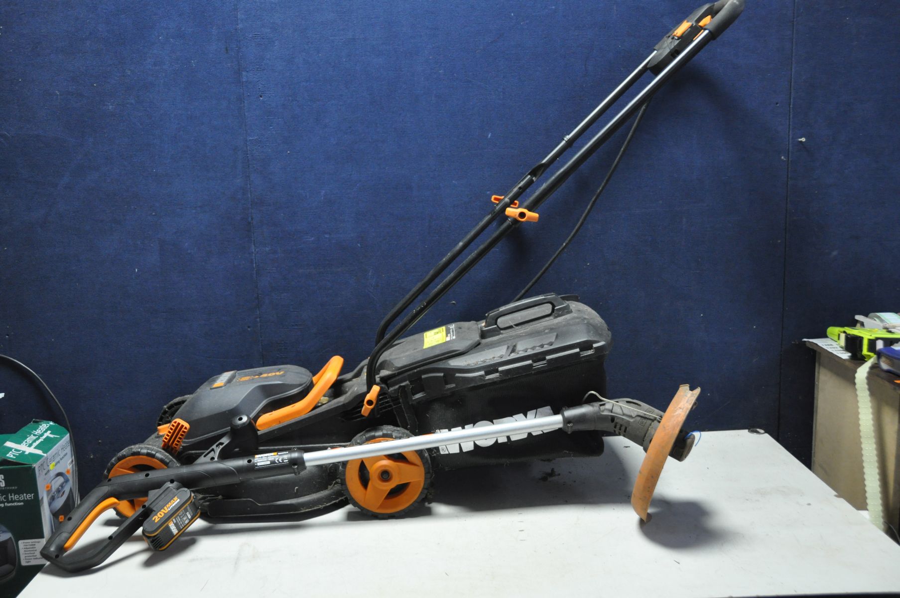 A WORX WG157E 20V STRIMMER and a Worx WG779E.2 40v lawn mower (two batteries and charger PAT pass