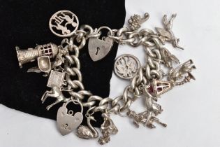 A SILVER CHARM BRACELET, a curb link bracelet each link stamped sterling, fitted with a heart shaped