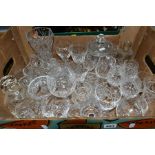 A BOX OF CUT CRYSTAL GLASSWARES AND A BOX OF CUTLERY, over thirty pieces of crystal and other