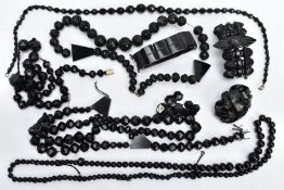 A BAG OF ASSORTED JET AND OTHER BEADS, to include an AF graduated bead necklace, a stretch bead