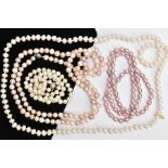 FOUR BAROQUE CULTURED PEARL NECKLACES, to include one pink oval shaped pearl strand approximate
