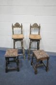 A PAIR OF CARVED OAK BAR STOOLS with rush seating and an iron hoop foot rest along with a pair of