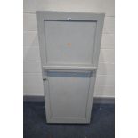 A GREEN PAINTED SINGLE DOOR CABINET, width 66cm x depth 57cm x height 154cm