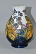 A MOORCROFT POTTERY BRAMBLES PATTERN BALUSTER VASE height 19cm, tubelined berries and brambles on