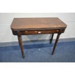 A GEORGIAN MAHOGANY TEA TABLE, fold over top, on turned legs, width 91cm x open depth 91cm x