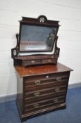 A MAPLE AND CO EDWARDIAN WALNUT DRESSING CHEST with three long drawers, brass drop handles and crown