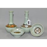 FOUR PIECES OF POOLE POTTERY, comprising two vases and two small dishes, mottled pale green ground