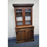 A VICTORIAN MAHOGANY BOOKCASE with two glazed door to top, ogee shaped long drawer over two cupboard