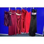 SIX SIZE FOURTEEN EVENING/PROM/BRIDESMAID DRESSES, comprising a burgundy Alfred Angelo dress, a