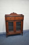 A LEXINGTON OF USA MAHOGANY VESTIGES DINING CHEST with a raised top, over two drawers and two glazed