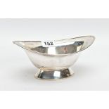 A SILVER BONBON DISH, of a navette form, plain polished design on a raised oval base, hallmarked '