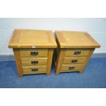 A PAIR OF SOLID GOLDEN OAK BEDSIDE CABINETS with three drawers, hoop handles, width 55cm x depth