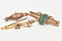 THREE LATE 19TH TO EARLY 20TH CENTURY GOLD BROOCHES, the first designed with a central circular