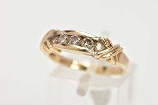 A 9CT GOLD FIVE STONE DIAMOND RING, designed as five brilliant cut diamonds, in a channel setting