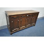 AN OAK GEOMETRIC PANELLED COFFER, width 120cm x depth 43cm x height 67cm (condition:-fluid marks)